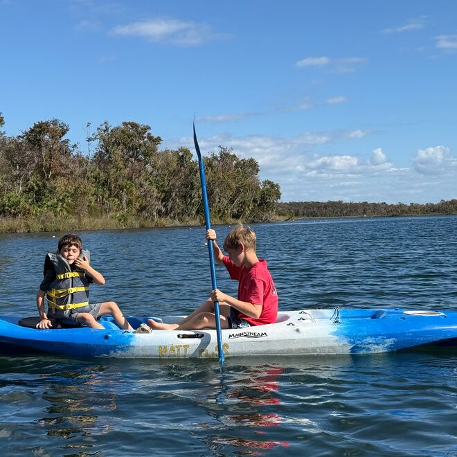 Family kayaking on Florida water